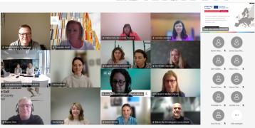 A group of people during an online meeting via Zoom